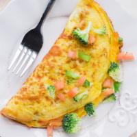 VEGGIE OMELETTE · Any style eggs, tomatoes, onions, peppers, mushroom, broccoli and spinach 
