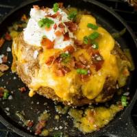 Baked Potatoes · Crisp potato with a soft center with the skin still on. 