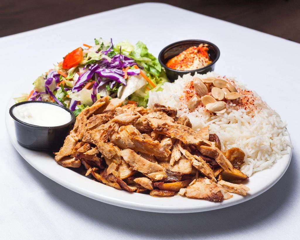 20. Chicken Shawarma Plate صحن دجاج · Marinated chicken served with salad and rice, onion, tomato, lettuce, tzatziki, hummus and choice of sauce.