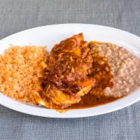 Pollo en Salsa De Chipotle · Chicken sauteed in chipotle sauce with onions. Served with rice beans and tortillas.