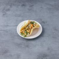 Chicken Taco · Chicken on soft corn tortillas with cilantro and chopped onions. Salsa on the side.