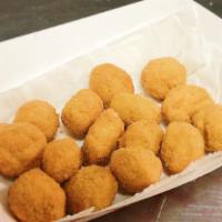 Hush Puppies · Fried cornmeal dough ball.
