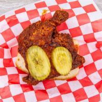 Large Dark Plate · Two leg quarters, kosher pickles, white bread. Nashville-style hot chicken.