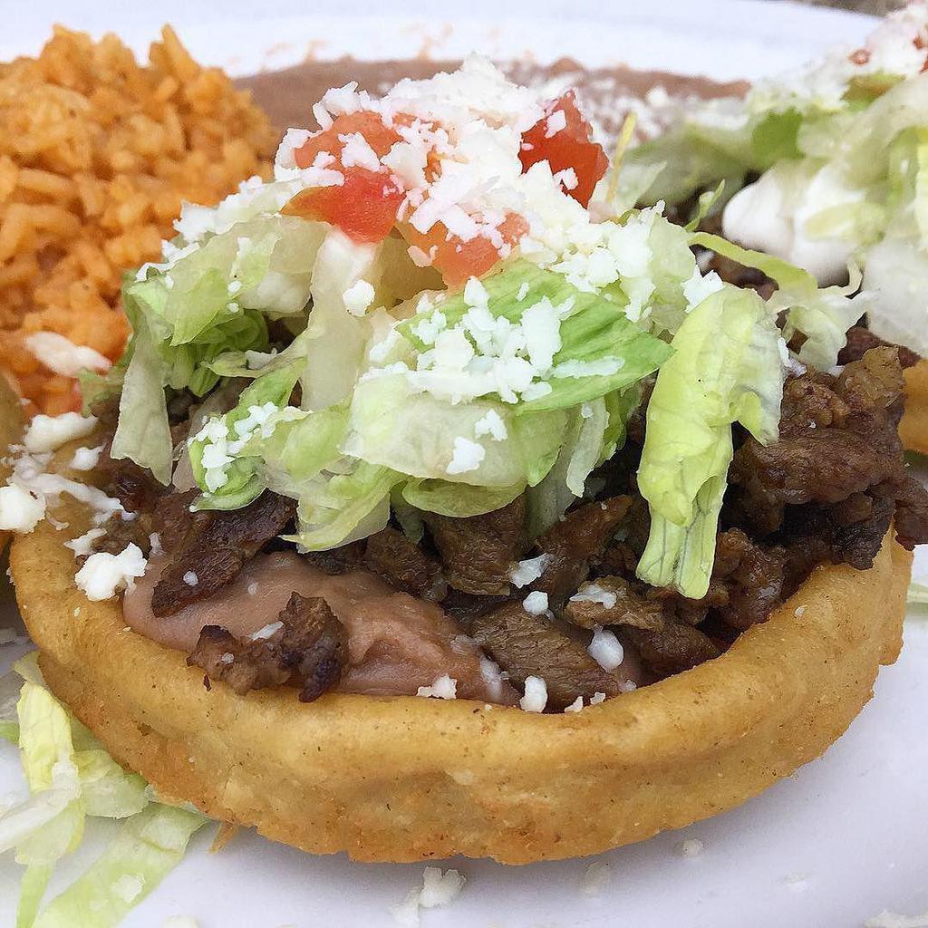 Sopes · 3 home made deep fried tortillas topped with beans, protein, lettuce, pico, guacamole salsa, and queso fresco. with a side of green salsa.