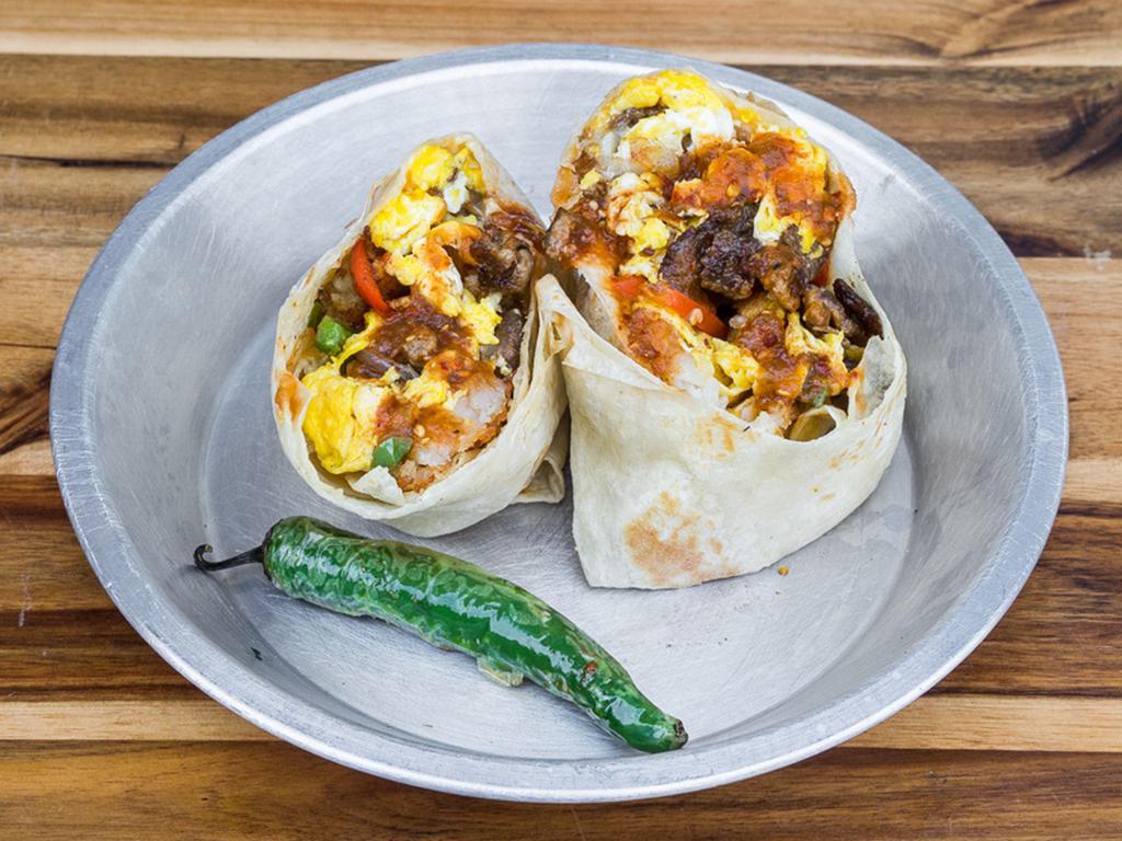 Padre Burrito · Steak, egg, cheese, bell peppers, grilled onions, potatoes, and red salsa.