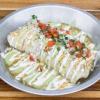 Wet Burrito · Chile verde, rice, beans, sour cream, guacamole sauce, salsa, pico de gallo, and cheese.