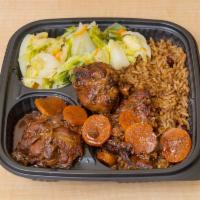 Brown Stew Chicken Dinner · Served with rice and salad or cabbage.