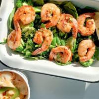 Paleo Shrimp Veggiebox · Grilled shrimp served over brussels, broccoli, green beans, kale and spinach served with a s...