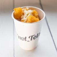 Truffle-Parm Tots · Tater tots dusted with truffle oil and Parmesan cheese - a house favorite!