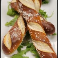 Pretzel Bread Sticks · Warm and Soft Bavarian pretzel sticks, lightly salted, 
baked and served with honey mustard
