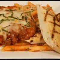 Chicken Parmesan · Fresh chicken breast hand breaded in seasoned bread crumbs, fried to a golden brown topped w...