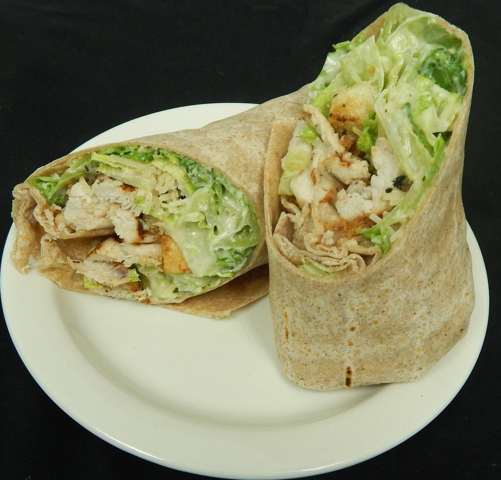 Chicken Caesar Wrap · Grilled chicken crisp romaine lettuce tossed in Caesar dressing, parmesan cheese and garlic croutons