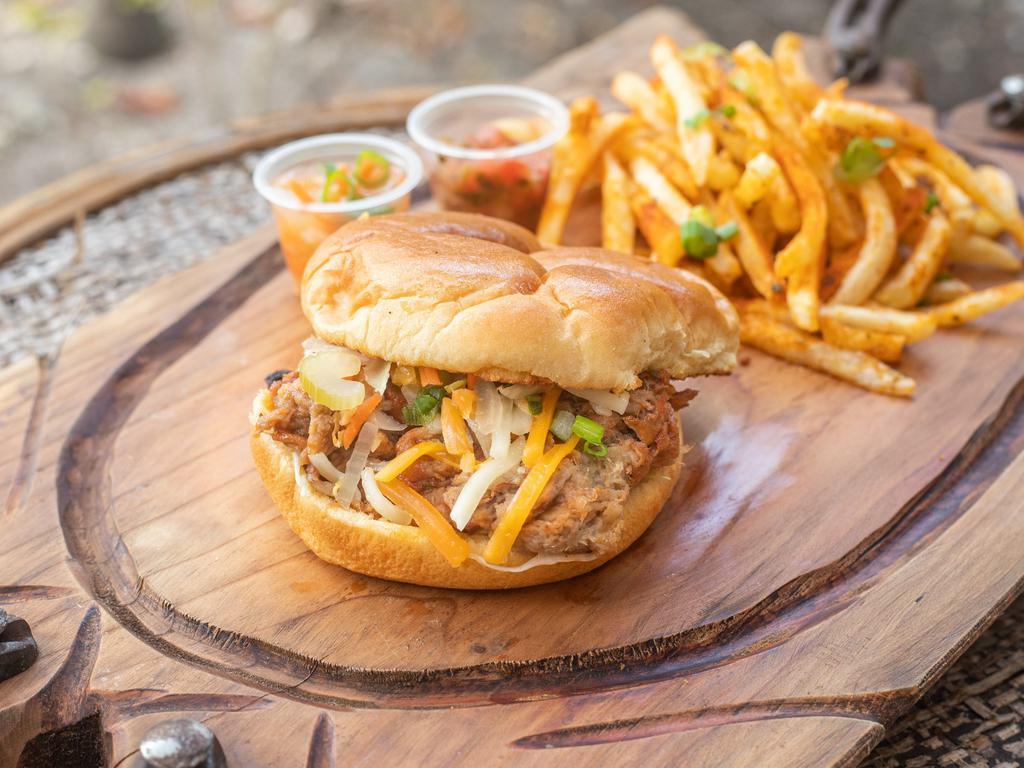 Slow and Low Cooked Bohemian Pulled Pork Sandwich · We butcher, brine, and smoke (slow and low) our pork. It is seasoned to perfection.You'll taste the difference once you bite, guaranteed. Served with seasoned fries on a toasted bun, with spicy mayo, shredded cheese and yves pickleez.
