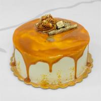 Caramel Cake · White sponge cake with walnuts filled with custard cream and dulce de leche topped with extr...