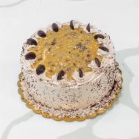 German Chocolate Cake · Moist German-style chocolate cake filled and iced with delicious caramel, coconut, and pecan...