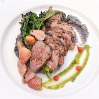 Charred Chimichurri Steak · Served chilled with pickled green strawberries, smashed black beans, charred greens and chim...