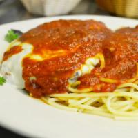 Eggplant Parmigiana · Fresh eggplant breaded in panko bread crumbs, topped with mozzarella cheese and smothered in...