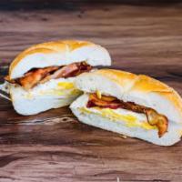  Bacon, Eggs and Cheese. · 2 fresh Eggs, 2 Strips of Bacon, and American Cheese on a Roll