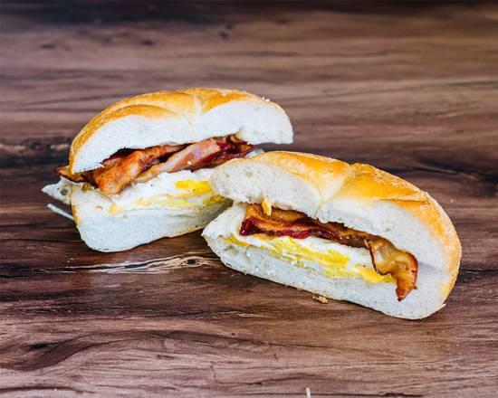  Bacon, Eggs and Cheese. · 2 fresh Eggs, 2 Strips of Bacon, and American Cheese on a Roll