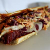 Reuben Sandwich · Boars Head Pastrami , Swiss cheese, cole slaw, and Russian dressing.