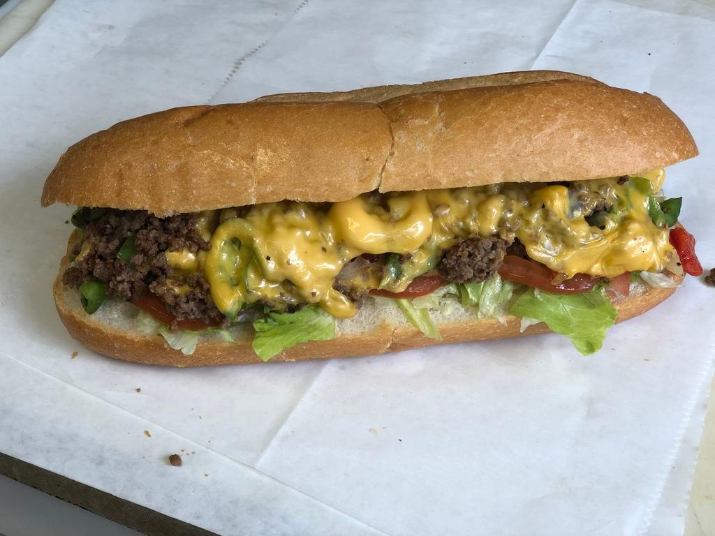 Philly Cheese Steak Sandwich · Philly Steak,  american cheese, sweet peppers, onions, lettuce, tomatoes and mayo.