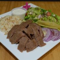 Beef Shawarma Platter · Sliced marinated beef with either basmati rice or french fries, plus 3 toppings of choice.