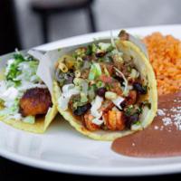 Shrimp Grilled Taco · Cabbage, black beans, corn, pico de gallo. Gluten free.