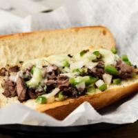 Philly Cheesesteak Hero · Thinly chopped Boar's Head brand Philly steak with sauteed onions and green peppers dripping...