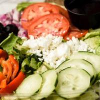 Greek Salad · Red Onion, Roasted Red Pepper, Black Olives, Cucumbers and Feta Cheese on a Bed of Romaine L...