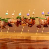 Moorish Style Spicy Pork Kabob · Spicy grilled pork cubes with mint and roasted garlic clove.