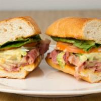 Pastrami Bomb Sandwich · Pastrami, Swiss, lettuce, tomatoes, onion and mayonnaise with honey mustard.