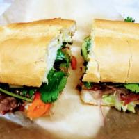 Thai Roast Beef Sandwich · Roast beef, carrots, cabbage, cucumber, cilantro and mayonnaise with peanut sauce and sweet ...