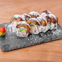 Caribbean Roll · Tempura salmon, cream cheese, avocado, fried maduros on top with toasted coconut, honey and ...