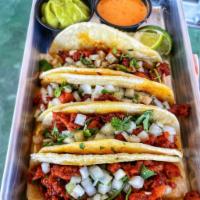 Pastor Taco  · Pork. Mayo, beans, onions & cilantro. Extra cheese and extras are available for an additiona...