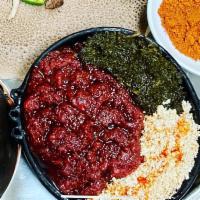 Quanta Firfir · Seasoned Ethiopian style beef jerky mixed with diced tomato, onion, garlic, jalapeno, Ethiop...
