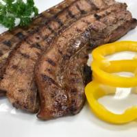 Grilled Pork Bellies · Thinly sliced bellies marinated in soy sauce, lemon, garlic and Thai hot peppers then grilled.