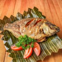 Fried Tilapia · Deep fried whole tilapia fish seasoned with salt and pepper. Not boneless.