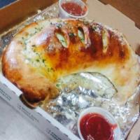 Large Calzone · Includes three toppings.