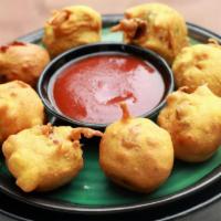 Aloo Bonda · Deep fried savory snack stuffed with potato spice mixture.