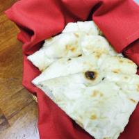 Naan · Leavened white bread baked in the tandoor.