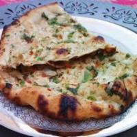 Onion Kulcha · Leavened bread topped with onions and spices.