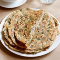 Paratha Methi · Multi-layered whole wheat bread with a touch of dried fenugreek.