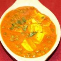 Kerau Paneer · Homemade cottage cheese cooked with onion and tomato sauce with peas.