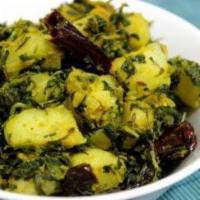 Alu Methi · Potatoes cooked with fenugreek, spices and Indian herbs.