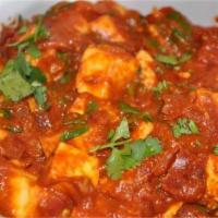 Paneer Masala · Homemade cheese cubes cooked in a thick tomato and cashew sauce.