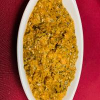 Chana Saag · Garbanzo beans cooked with pureed spinach with ginger, garlic and spices.
