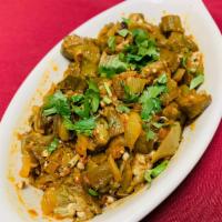 Vindi Masala · Okra sauteed with tomatoes, onion and bell pepper with ginger, garlic and spices.