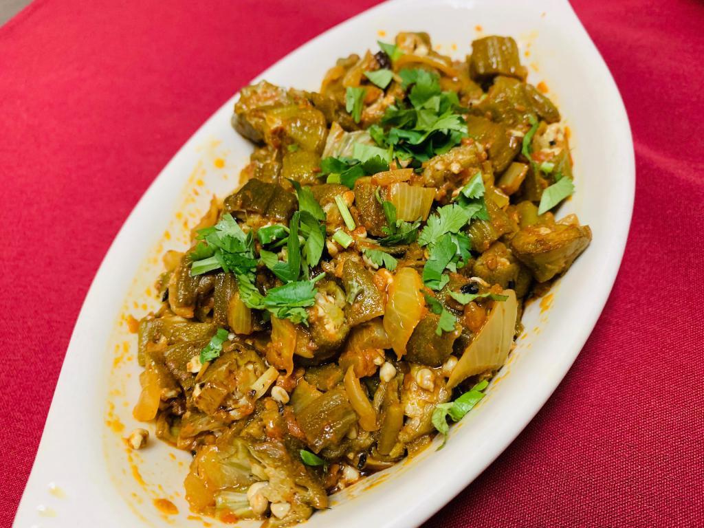 Vindi Masala · Okra sauteed with tomatoes, onion and bell pepper with ginger, garlic and spices.