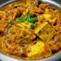 Karahi Paneer · Indian dish of sauteed homemade cottage cheese with green pepper, onion and tomato in a rich...