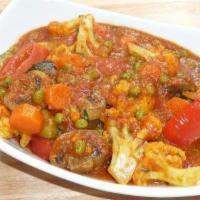 Vegetable Curry · Traditional dish cooked with fresh mixed vegetables, onion, ginger, tomatoes and curry spices.